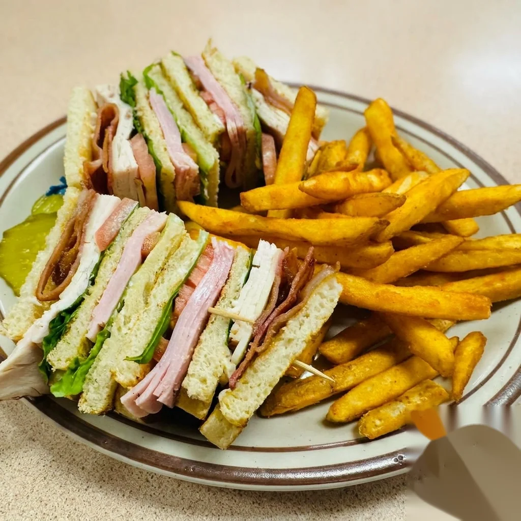 Breakers Club triple decker sandwich with fries
